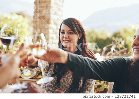 Toast, celebration and friends at a lunch with love, happy and smile during a patio party. Cheers, food and family with wine to celebrate Christmas or Thanksgiving in the backyard of a house 129721741