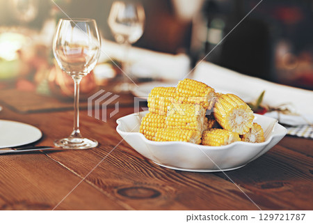Background, corn and maize, dinner table and lunch party, celebration and eating in christmas, thanksgiving and festive holidays. Food and drink, healthy grain vegetables and meal on table setting 129721787