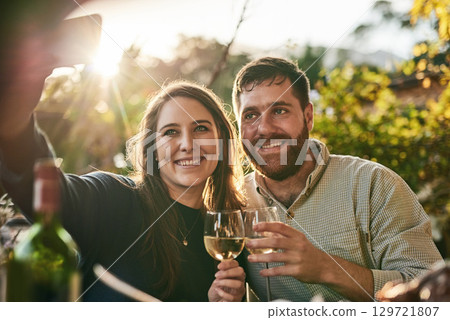 Couple, happy selfie and wine at vineyard, wine farm and smile on holiday, vacation and outdoor. Woman, man and wine glass in digital photo in summer sunshine, together and love in Marseille, France 129721807