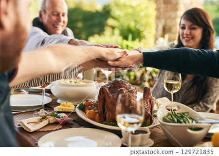 We all made this day possible. Hands together, food and family celebrate with dinner, party and support, trust and feast for holiday or anniversary celebration. 129721835