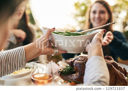 Family hands, thanksgiving food and green beans salad in holiday celebration, social lunch or dinner gathering in house, home or restaurant. Zoom, woman or festive friends sharing vegetables and meat Family hands, thanksgiving food and green beans salad in holiday celebration, social lunch or dinner gathering in house, home or restaurant. Zoom, woman or festive friends sharing vegetables and meat 129721837