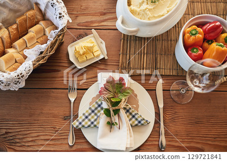 Food, breakfast and top view, meal and nutrition with plate, healthy with pepper, bread and butter on table. Nutrition, napkin and cutlery for feast, healthy dish and lunch in home during morning Food, breakfast and top view, meal and nutrition with plate, healthy with pepper, bread and butter on table. Nutrition, napkin and cutlery for feast, healthy dish and lunch in home during morning 129721841
