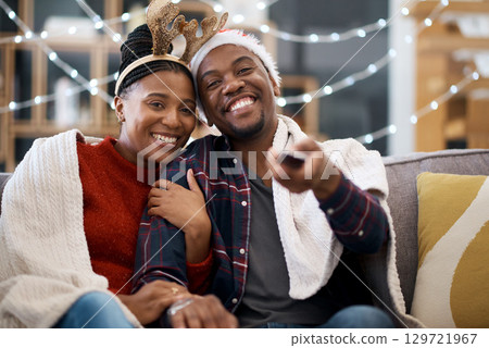 Watching tv, couple and relax on a sofa for christmas show, movie or film in living room in a home. Love, tv and man with woman portrait on couch for festive celebration tv show, channel and surfing 129721967