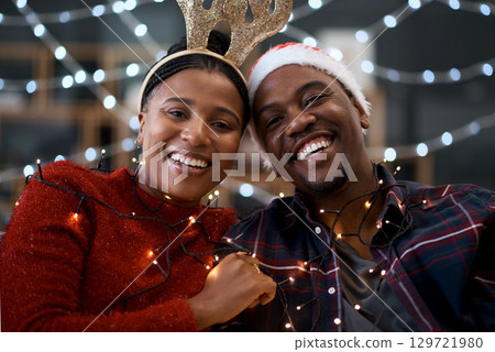 Black couple, Christmas and portrait smile for happy relationship bonding during festive season in the outdoors. Man and woman hug, smiling and enjoying quality time in celebration with city lights Black couple, Christmas and portrait smile for happy relationship bonding during festive season in the outdoors. Man and woman hug, smiling and enjoying quality time in celebration with city lights 129721980