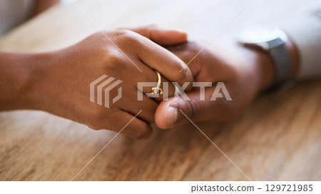 Holding hands, support and trust with couple and love, solidarity, comfort and care with hands zoom against wood table. Partnership, marriage and relationship, helping hand and commitment closeup. Holding hands, support and trust with couple and love, solidarity, comfort and care with hands zoom against wood table. Partnership, marriage and relationship, helping hand and commitment closeup. 129721985