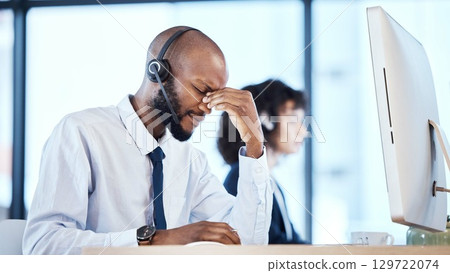 Stress, burnout and headache by call center worker, employee and customer service consultant in office. Pain, mental health and depressed telemarking agent overworked and frustrated at the workplace Stress, burnout and headache by call center worker, employee and customer service consultant in office. Pain, mental health and depressed telemarking agent overworked and frustrated at the workplace 129722074