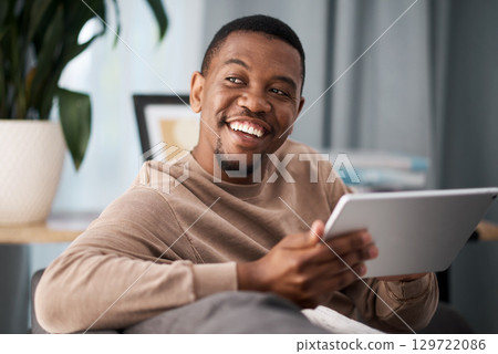 Black man, digital tablet and social media, living room home and streaming app, reading ebook or online shopping on technology. Happy guy, wifi connection and relax in lounge, wifi internet and ideas Black man, digital tablet and social media, living room home and streaming app, reading ebook or online shopping on technology. Happy guy, wifi connection and relax in lounge, wifi internet and ideas 129722086