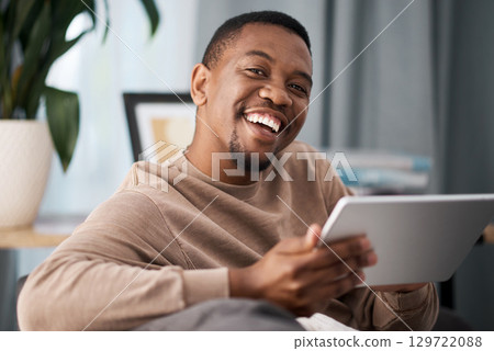 Black man, tablet and portrait smile for entertainment, movie streaming or fast speed connection at home. Happy African American male smiling in satisfaction holding touchscreen for wifi connectivity 129722088