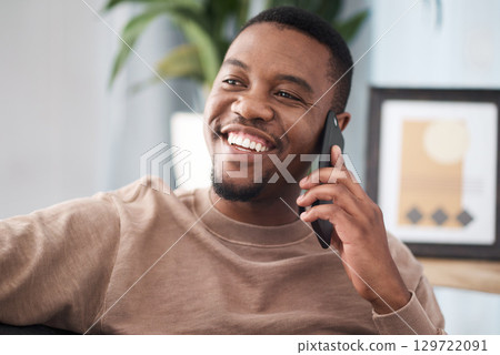 Black man, phone call and relax in home, house and living room, mobile communication and contact social network. Happy young african guy talking on smartphone, conversation and cellphone technology Black man, phone call and relax in home, house and living room, mobile communication and contact social network. Happy young african guy talking on smartphone, conversation and cellphone technology 129722091