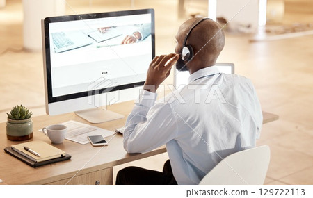 Black man, call center and computer for tech support, communication and crm help at desk in office. Telemarketing expert, contact us and pc at desk for customer service for consulting on voip tech Black man, call center and computer for tech support, communication and crm help at desk in office. Telemarketing expert, contact us and pc at desk for customer service for consulting on voip tech 129722113