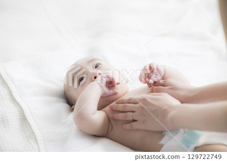 Young mother taking care of her baby 129722749