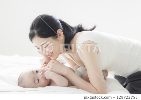 Young mother taking care of her baby 129722753