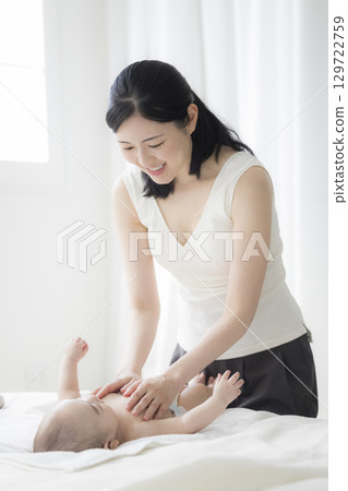 Young mother taking care of her baby 129722759