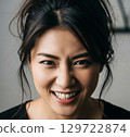 A woman with a laughing face 129722874