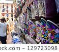 Slippers or sandals of many colors hung from street stalls in Marrakech's souk 129723098