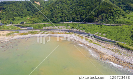 Shiroyone Senmaida rice fields and the uplifted coastline. Shiroyone Senmaida rice fields undergoing restoration following damage caused by the 2024 Noto Peninsula earthquake and heavy rains. Aerial view. 129723488