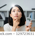 A woman with a flash of inspiration 129723631