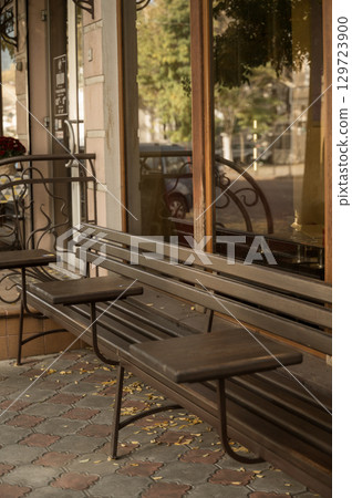 tables and benches near a street cafe tables and benches near a street cafe 129723900