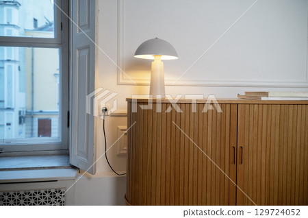 Wooden chest of drawers in the living room 129724052