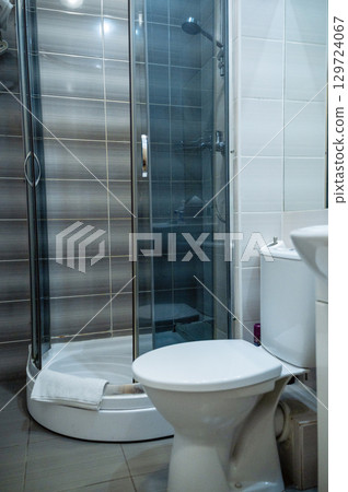 Double bed with pillows and light from the window. Double bed with pillows and light from the window. 129724067