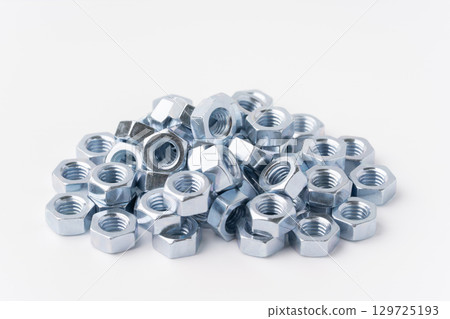 Lots of nuts on a white background Lots of nuts on a white background 129725193