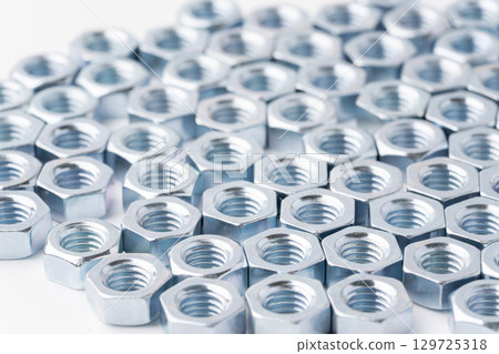 Nuts lined up in a row 129725318