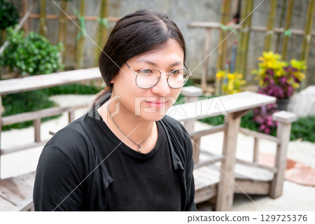 Woman (LGBTQ) posing outdoor fashion style 129725376