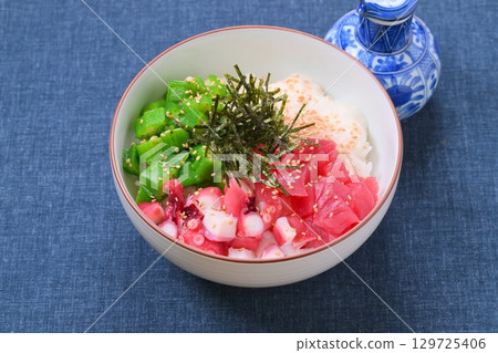 A sticky and creamy summer seafood bowl, summer dish, okra, grated yam, tuna, and octopus. A sticky and creamy summer seafood bowl, summer dish, okra, grated yam, tuna, and octopus. 129725406