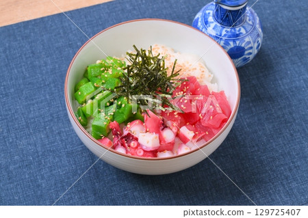 A sticky and creamy summer seafood bowl, summer dish, okra, grated yam, tuna, and octopus. A sticky and creamy summer seafood bowl, summer dish, okra, grated yam, tuna, and octopus. 129725407