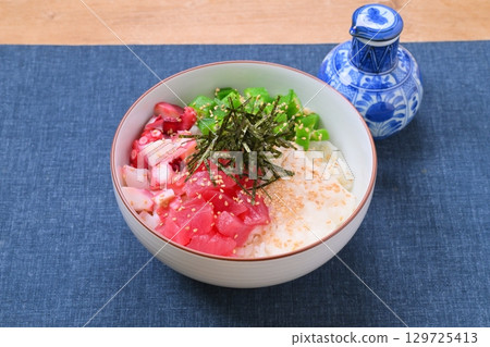 A sticky and creamy summer seafood bowl, summer dish, okra, grated yam, tuna, and octopus. A sticky and creamy summer seafood bowl, summer dish, okra, grated yam, tuna, and octopus. 129725413