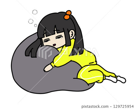 A pigtailed girl who looks like she's about to fall asleep on a cushion 129725954