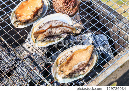 Food grilled on a barbecue grill 129726084