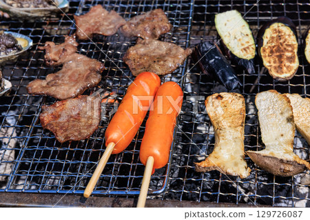 Food grilled on a barbecue grill 129726087