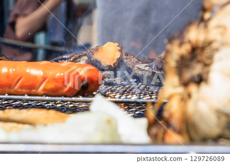 Food grilled on a barbecue grill Food grilled on a barbecue grill 129726089