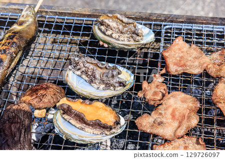 Food grilled on a barbecue grill Food grilled on a barbecue grill 129726097