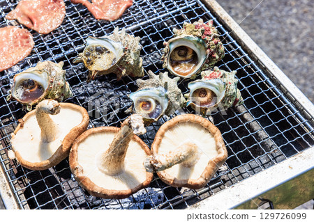 Food grilled on a barbecue grill Food grilled on a barbecue grill 129726099