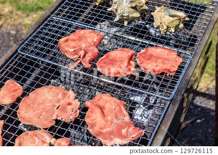 Food grilled on a barbecue grill Food grilled on a barbecue grill 129726115