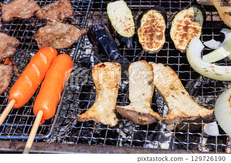 Food grilled on a barbecue grill 129726190