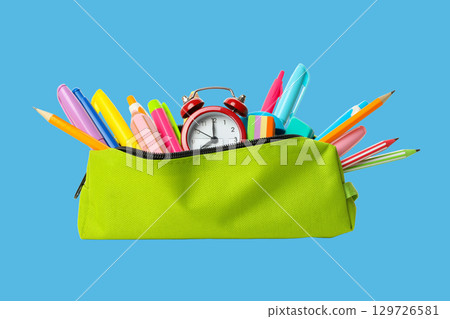 Brightly colored tools and a clock signal preparation for school 129726581