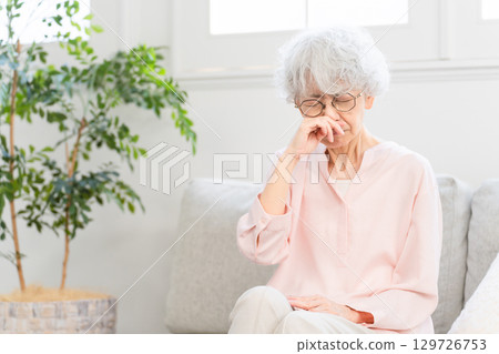 Senior woman with stuffy nose Senior woman with stuffy nose 129726753