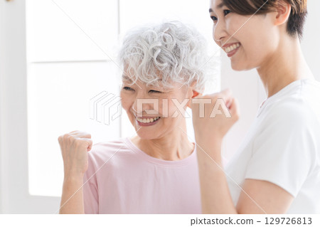 Young and senior women doing yoga, healthy image Young and senior women doing yoga, healthy image 129726813