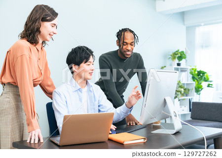 Multinational group meeting in office 129727262