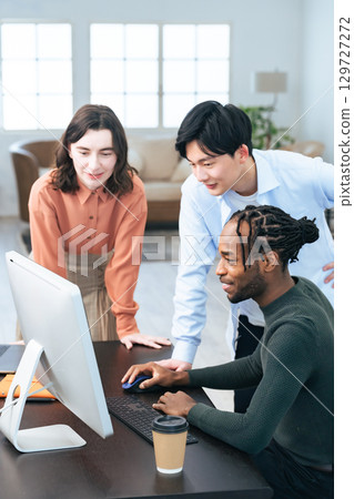 Multinational group meeting in office 129727272