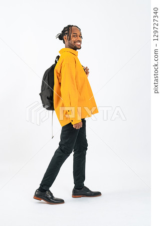 Full body photo of a black man looking back Full body photo of a black man looking back 129727340