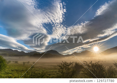 Morning mist and clouds rising from Odashirogahara in Oku-Nikko in summer 129727780
