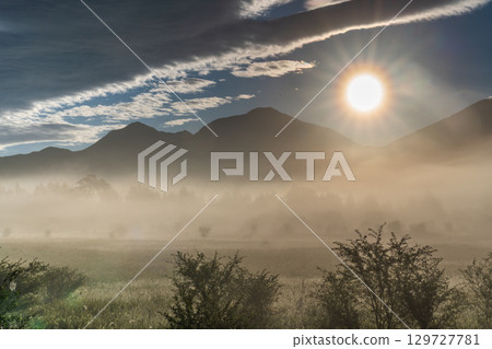 Morning mist and clouds rising from Odashirogahara in Oku-Nikko in summer 129727781