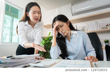Workplace Tension. Employee feeling overwhelmed during a critical performance review. 129728033