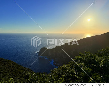 Osezaki Lighthouse and the spectacular sunset view of the sea on Fukue Island in the Goto Islands, Nagasaki Prefecture 129728348