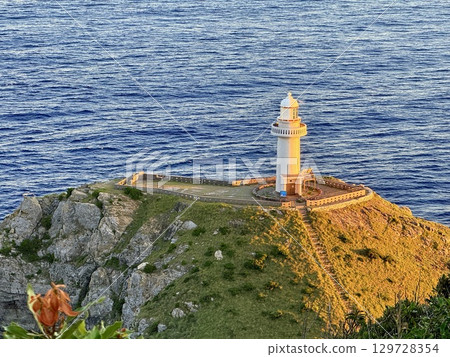 Osezaki Lighthouse and the spectacular sunset view of the sea on Fukue Island in the Goto Islands, Nagasaki Prefecture 129728354