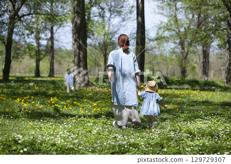 Parents and children picking flowers Parents and children picking flowers 129729307